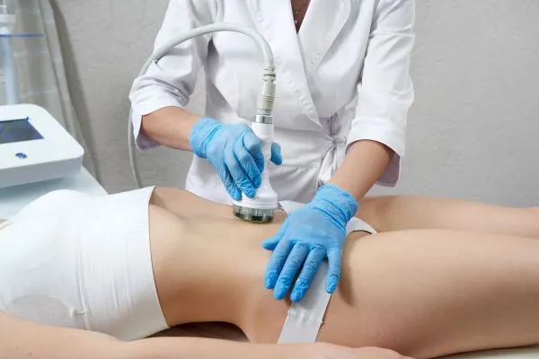 Lost the Weight but Not the Loose Skin? 2 woman having HIFU treatment on her stomach to combat loose skin Maidenhead following weight loss